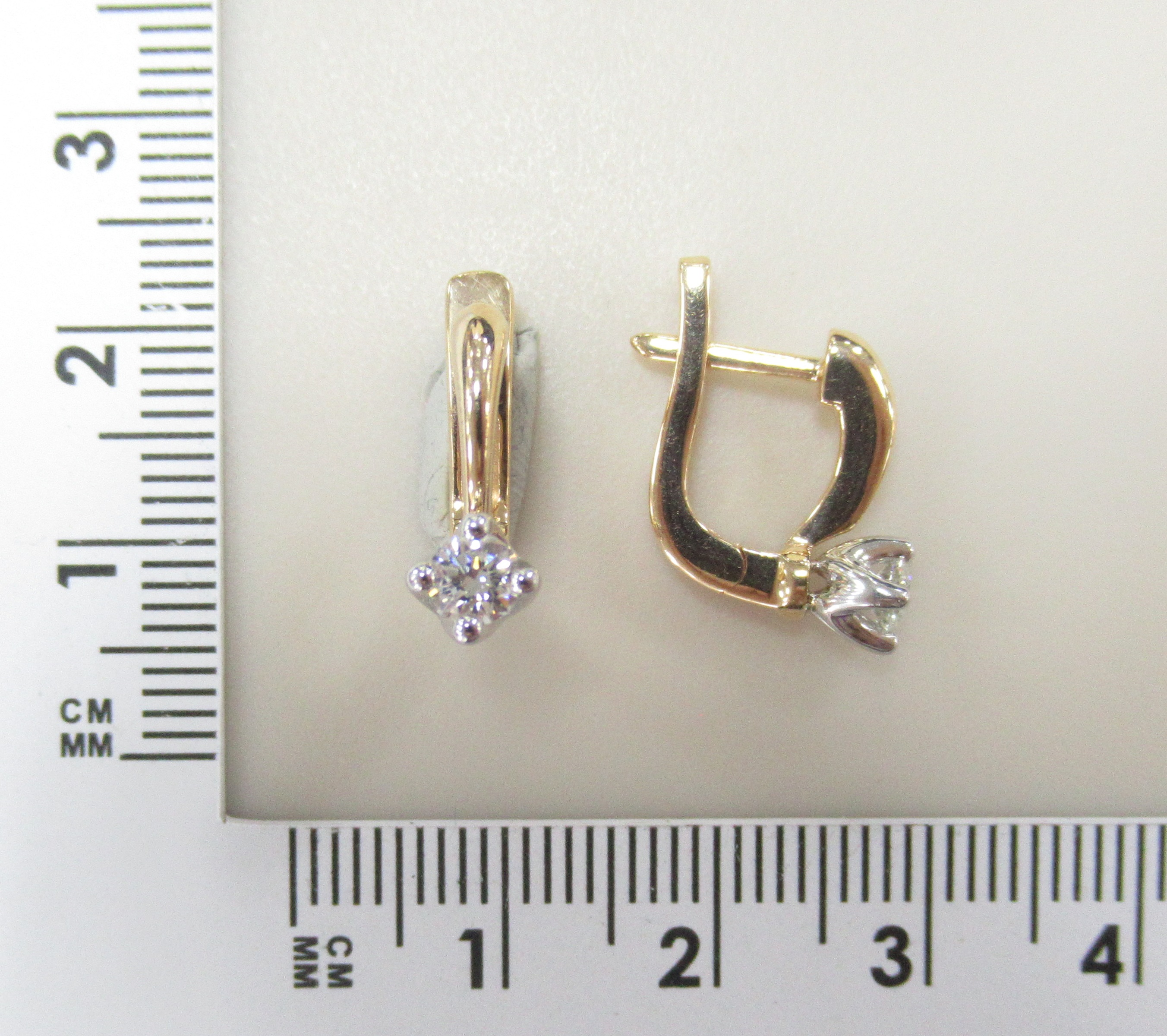 Золотые серьги 585 пробы; красное,белое золото; родий; вставки 2 Бр.Кр-57 0,37 3/5А